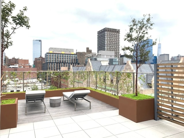 view of patio / terrace featuring a balcony and a city view