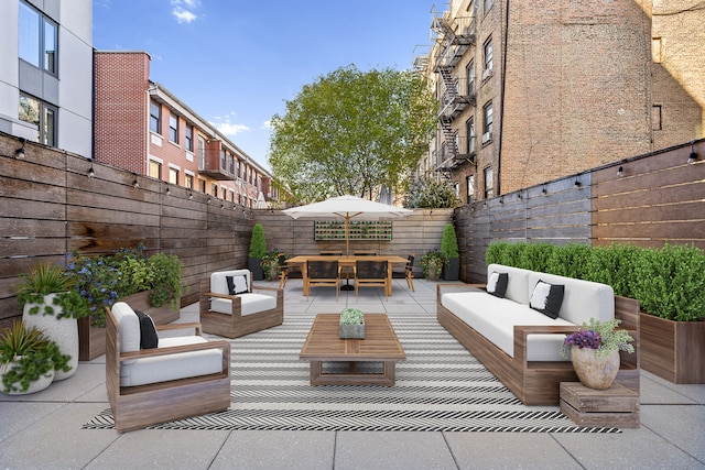 view of patio / terrace featuring outdoor lounge area and a fenced backyard