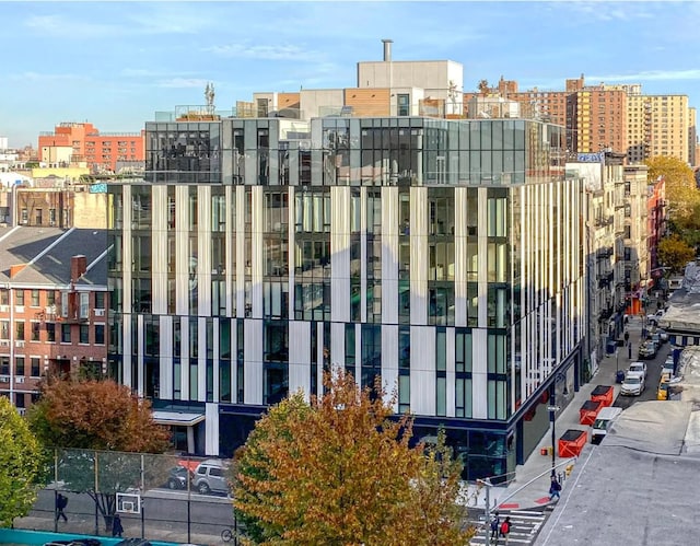 view of building exterior featuring a view of city