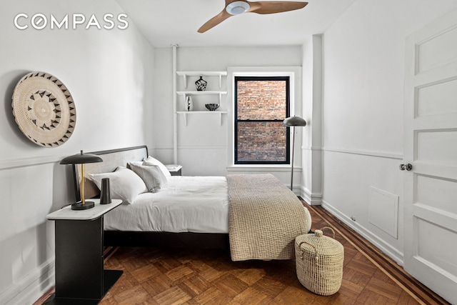 bedroom featuring baseboards and a ceiling fan