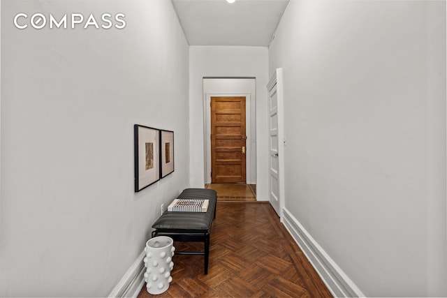 hallway featuring baseboards