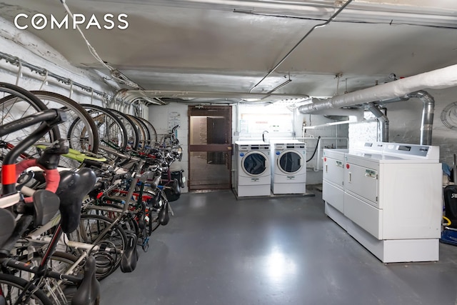 garage with bike storage and washer and clothes dryer