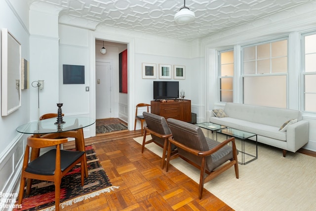 living room with a decorative wall