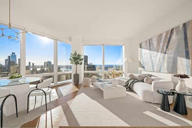 sunroom featuring a chandelier and a view of city