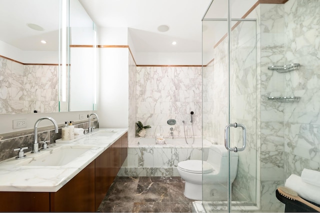 bathroom with a bathtub, a sink, and a marble finish shower