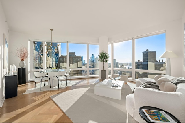 living area with a view of city and an inviting chandelier