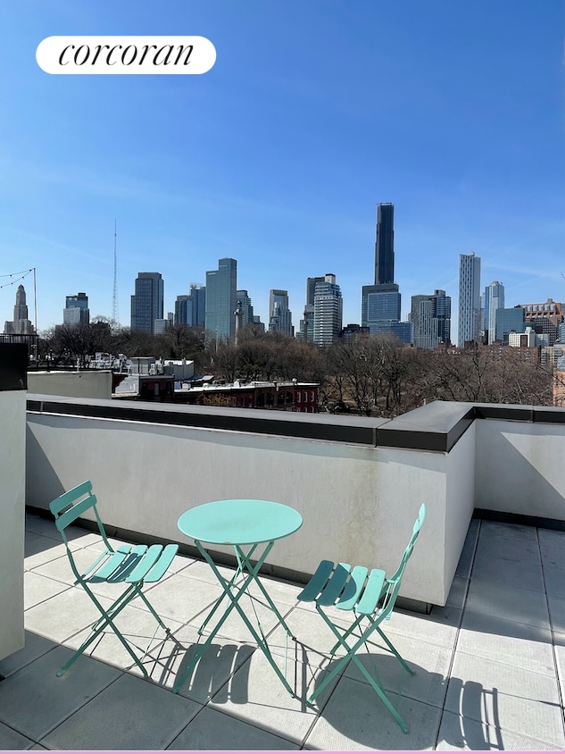 balcony featuring a skyline view