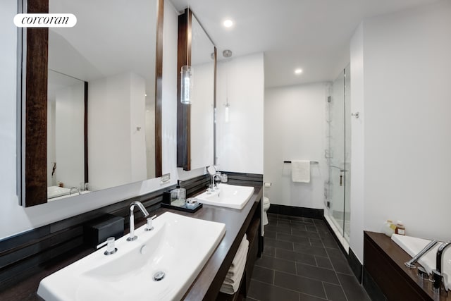 full bath featuring a shower stall, toilet, tile patterned flooring, baseboards, and recessed lighting