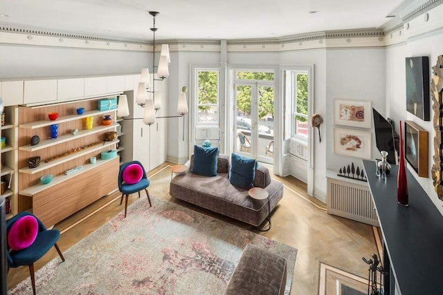 living area with radiator heating unit and baseboards