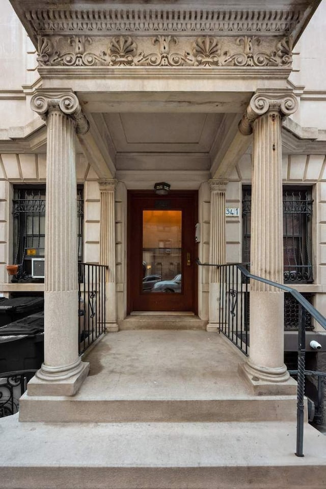 entrance to property featuring stone siding