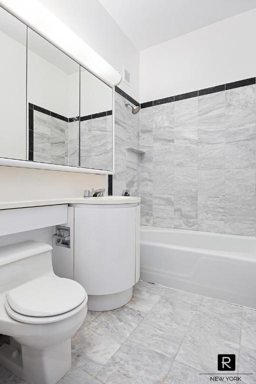 full bath featuring washtub / shower combination, visible vents, vanity, and toilet