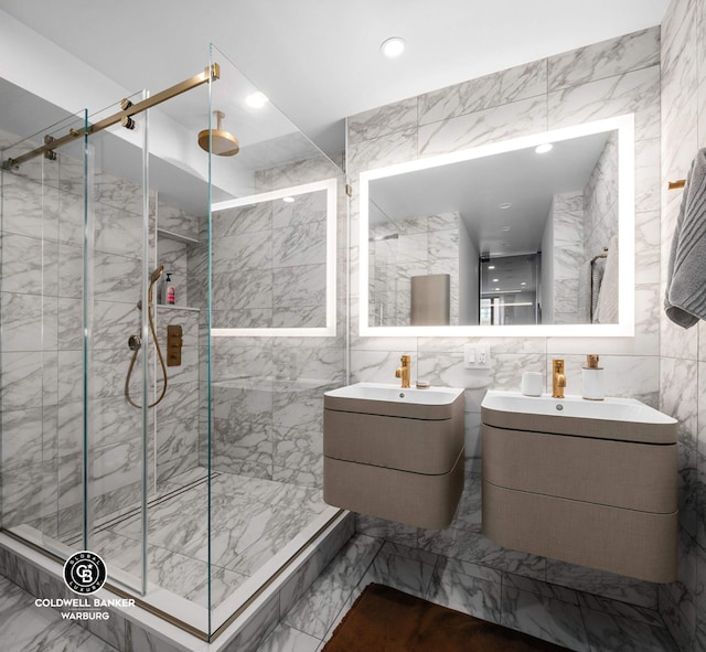 190 E 72nd St Unit 31B, New York City, NY 10021 - bathroom featuring marble finish floors, a marble finish shower, vanity, tile walls, and recessed lighting