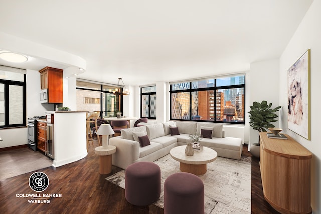 living area featuring dark wood-style floors and a chandelier