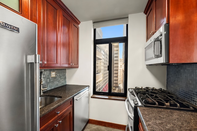 400 E 70th St Unit 1001, New York City, NY 10021 - kitchen featuring stainless steel appliances, dark brown cabinets, backsplash, and dark stone counters