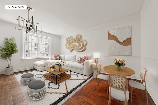 living room featuring visible vents, baseboards, and an inviting chandelier