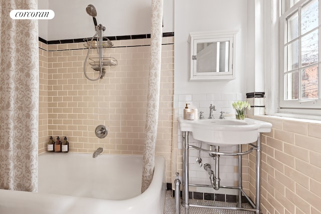 1 Grace Ct Unit 4C, New York City, NY 11201 - full bath with tile walls, shower / tub combo with curtain, and a wainscoted wall