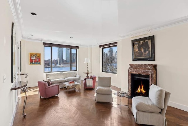 living area with ornamental molding, recessed lighting, a high end fireplace, and baseboards