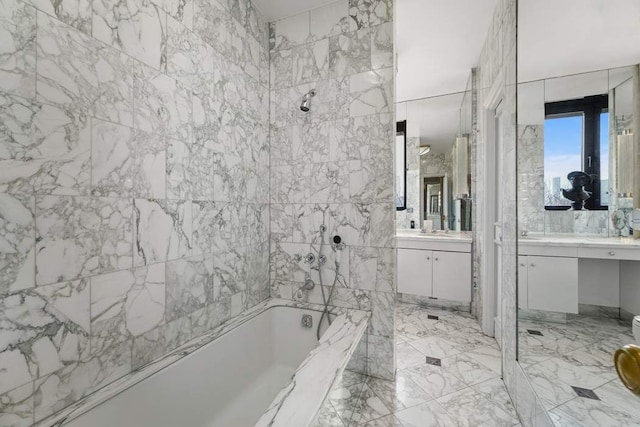 bathroom with marble finish floor and vanity