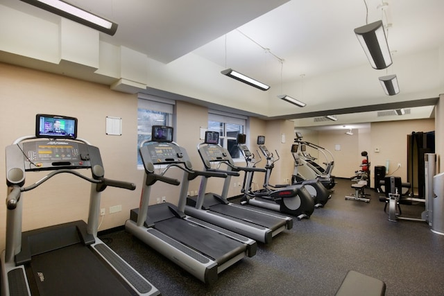 exercise room featuring visible vents