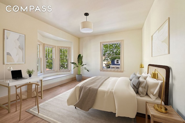 bedroom with wood finished floors