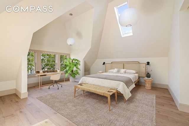 bedroom featuring a skylight, light wood-style flooring, baseboards, and high vaulted ceiling