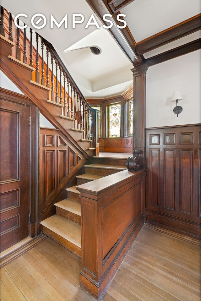 stairway featuring wood finished floors