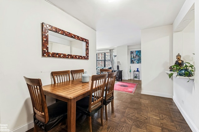 dining space featuring baseboards