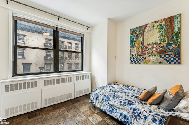 bedroom featuring radiator heating unit