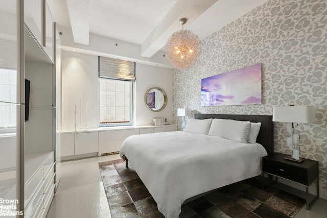 bedroom with a notable chandelier, an accent wall, beamed ceiling, and wallpapered walls