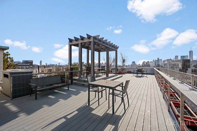 deck featuring a view of city and a pergola