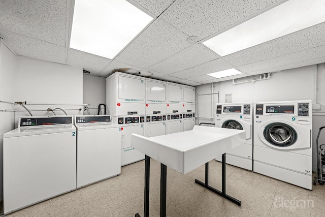 community laundry room featuring stacked washing maching and dryer, separate washer and dryer, and light floors