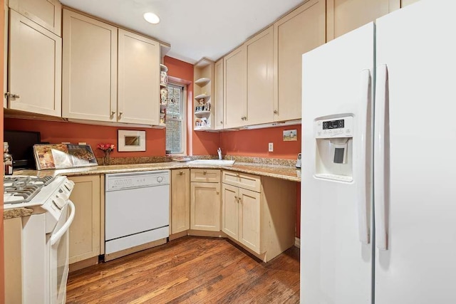 kitchen featuring open shelves, light countertops, light wood-style flooring, a sink, and white appliances