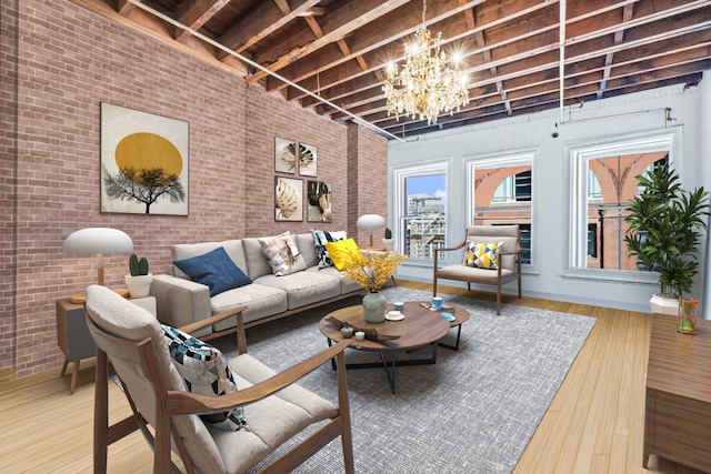 living area with baseboards, brick wall, wood finished floors, a high ceiling, and a chandelier