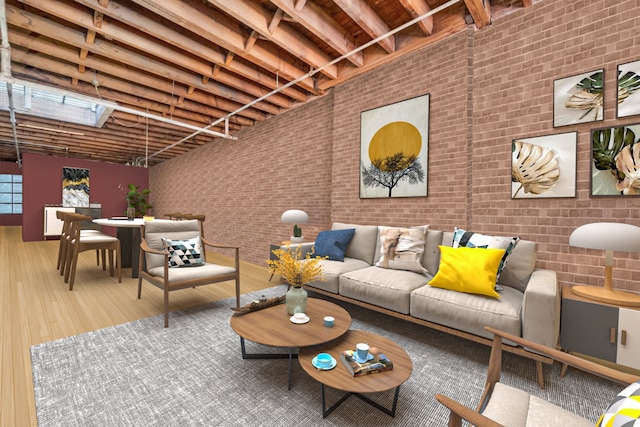 living area with brick wall and wood finished floors