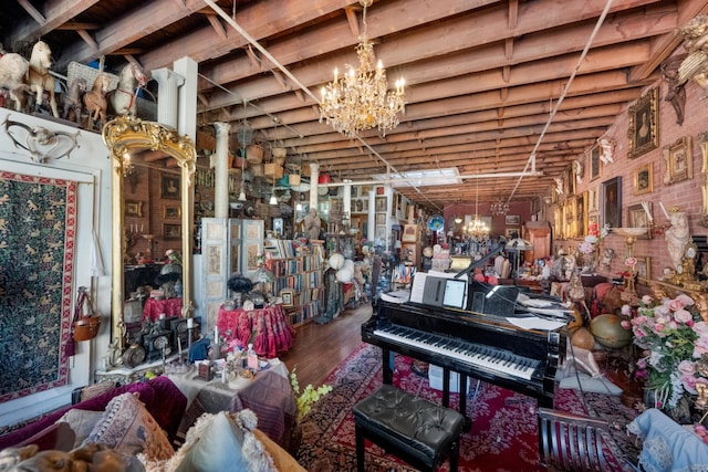 misc room with an inviting chandelier and wood finished floors