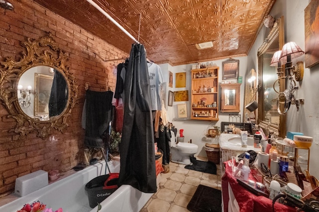 full bath featuring an ornate ceiling, toilet, shower / tub combo, vanity, and brick wall