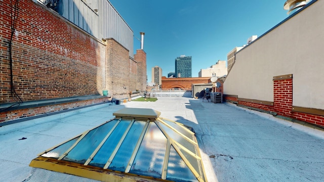 view of pool featuring a city view and a patio