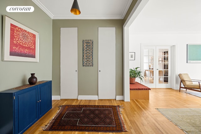 foyer entrance featuring french doors, ornamental molding, parquet flooring, and visible vents