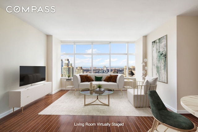 living room with baseboards and wood finished floors