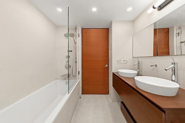bathroom with tile patterned flooring, shower / bath combination, recessed lighting, and double vanity