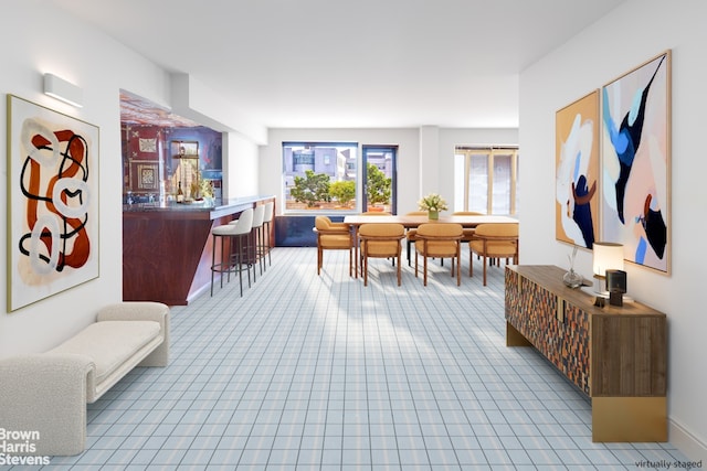 sitting room featuring a dry bar and light tile patterned floors