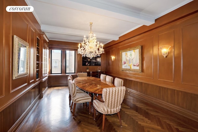 dining room featuring visible vents, a chandelier, beam ceiling, and a decorative wall