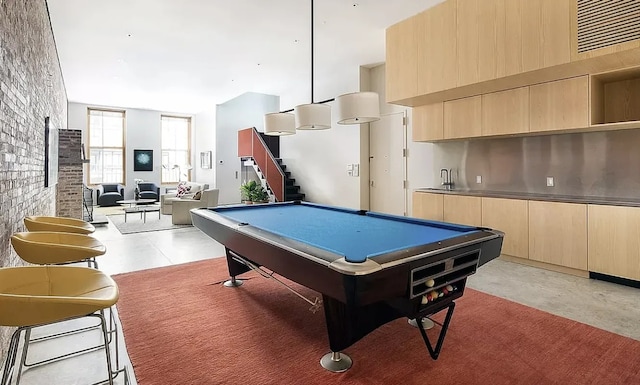 75 Warren St, New York City, NY 11201 - recreation room with concrete flooring, pool table, and brick wall