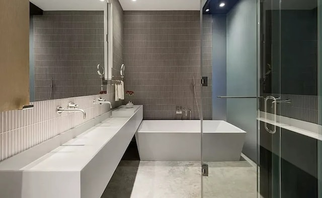 75 Warren St, New York City, NY 11201 - full bathroom with tasteful backsplash, a stall shower, a freestanding tub, and tile walls