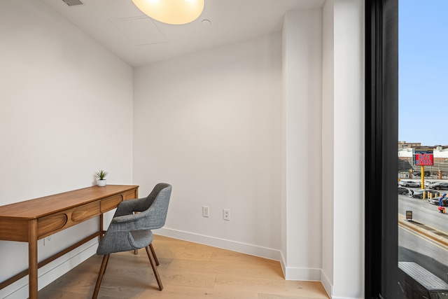 office featuring light wood-style floors and baseboards