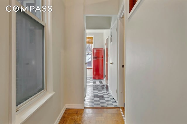 corridor featuring baseboards