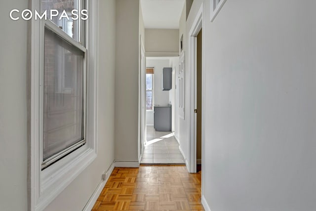 corridor featuring baseboards