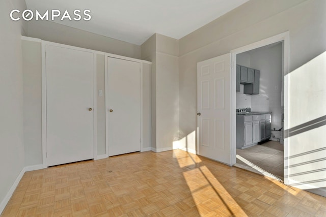 unfurnished bedroom featuring baseboards