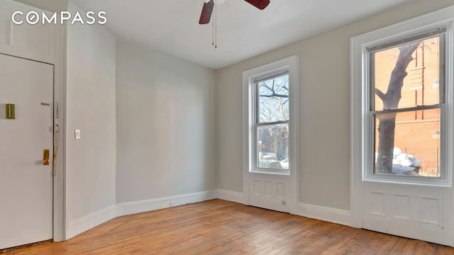 entrance foyer featuring baseboards, ceiling fan, and wood-type flooring