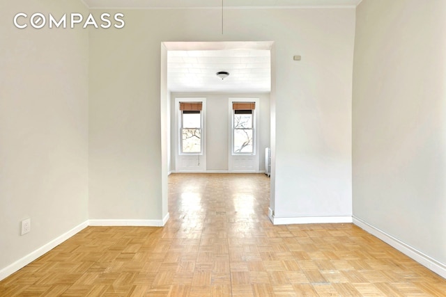spare room featuring baseboards